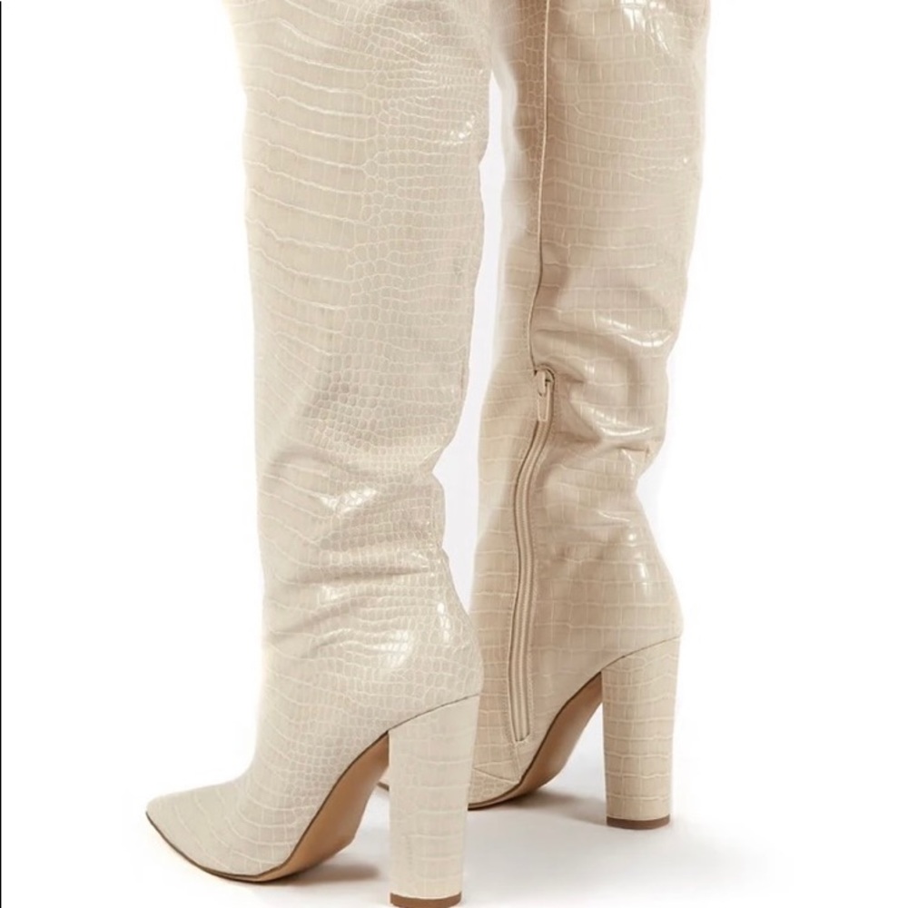 Nude croc print knee high boots with a block heel.